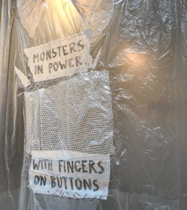 photo of installation with text by Beverly Naidus