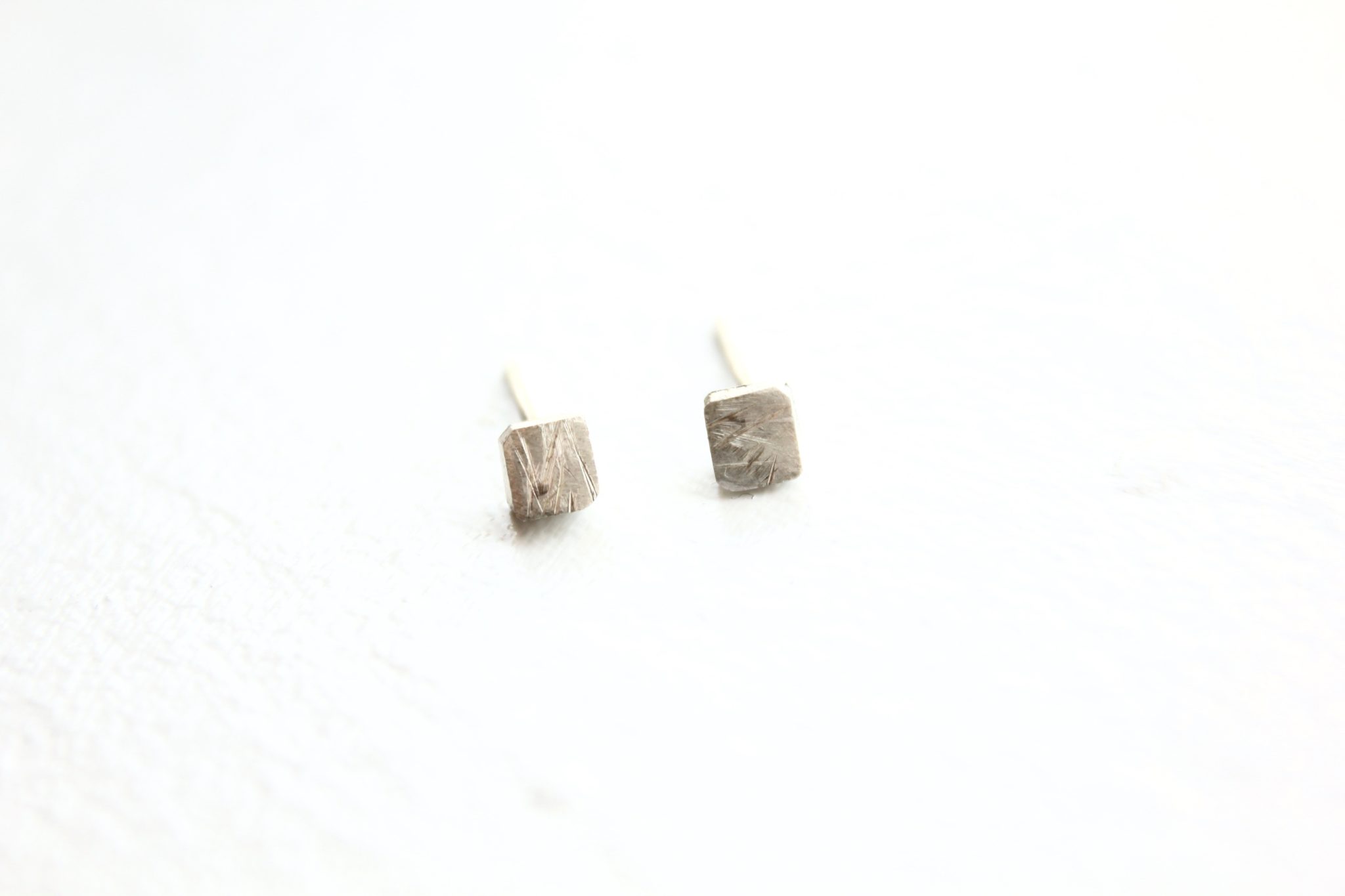 Silver cube stud earrings by Tricia Made